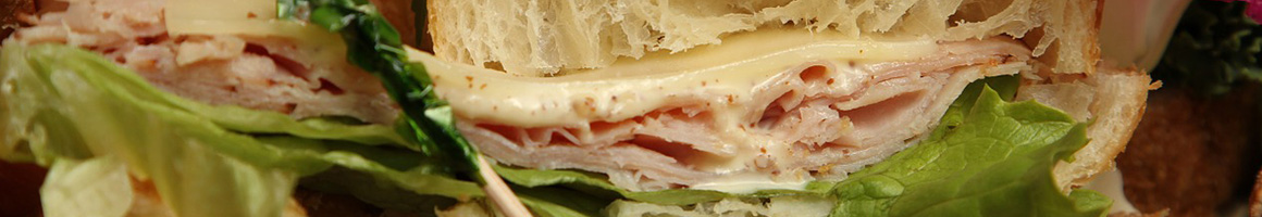 Eating Deli Sandwich at Mike's Famous Ham Place restaurant in Detroit, MI.